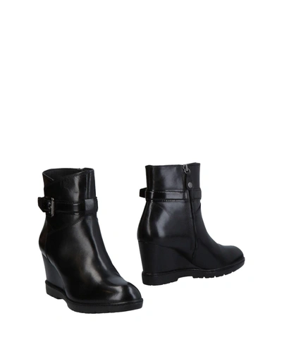 Shop Alaïa Ankle Boot In Black