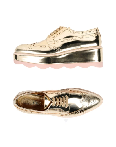 Shop Prada Laced Shoes In Gold