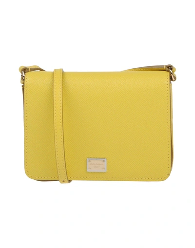 Shop Dolce & Gabbana Cross-body Bags In Yellow