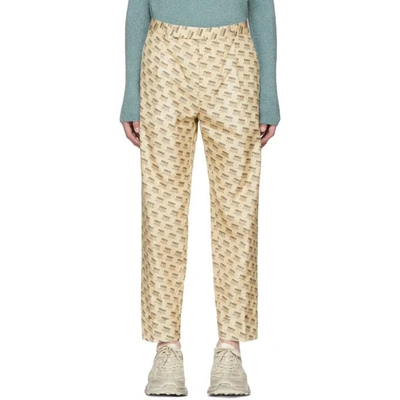 Shop Gucci Tan All Over Logo Formal Trousers In 9285