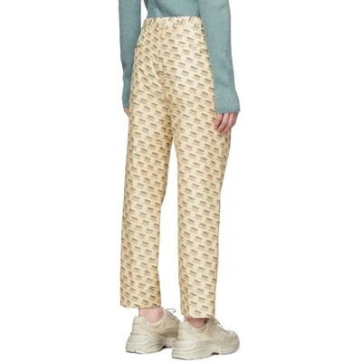 Shop Gucci Tan All Over Logo Formal Trousers In 9285