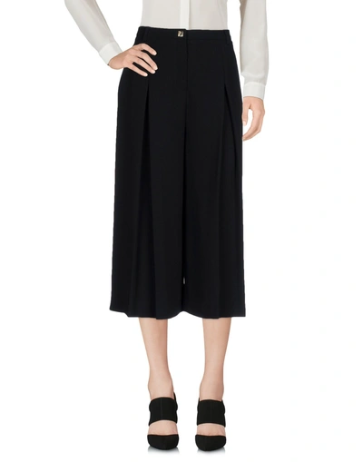 Shop Versace Cropped Pants & Culottes In Black
