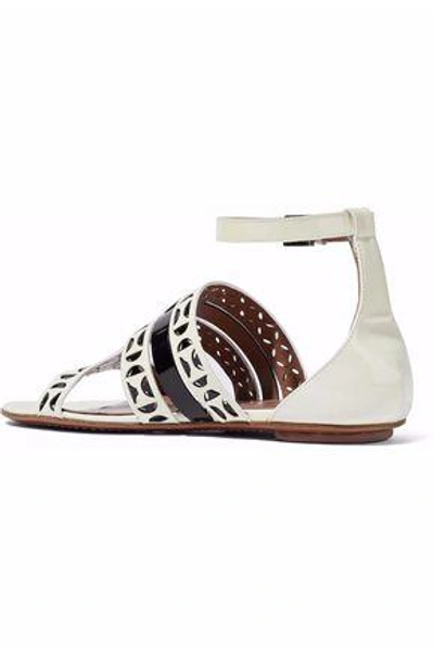 Shop Alaïa Laser-cut Patent-leather Sandals In Ivory
