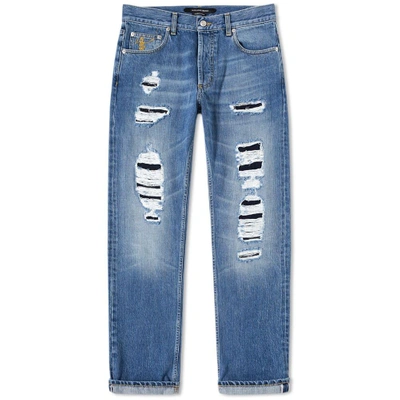 Shop Alexander Mcqueen Distressed Slim Fit Jeans In Blue