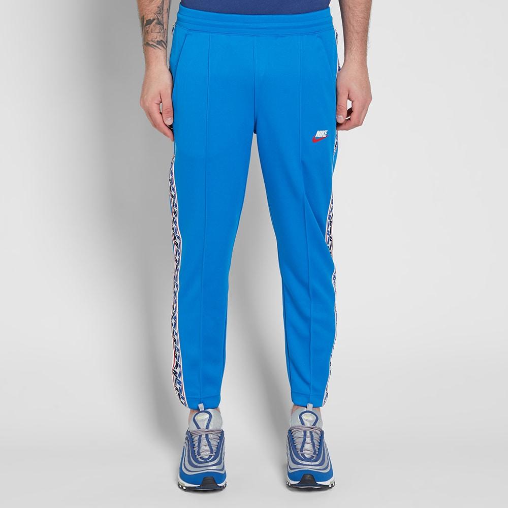 Nike Taped Poly Pant In Blue | ModeSens