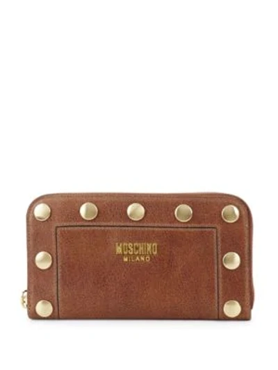 Shop Moschino Studded Leather Zip-around Wallet In Brown