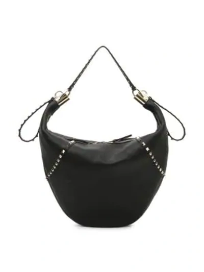 Shop Valentino Small Rockstud Leather Hobo Bag In Black