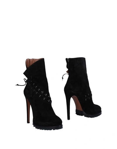 Shop Alaïa Ankle Boots In Black