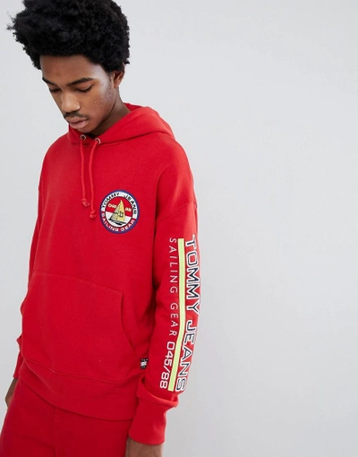 Shop Tommy Jeans 90s Sailing Capsule Back And Sleeve Logo Hoodie In Red - Red