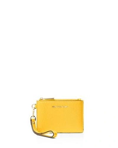 Shop Michael Michael Kors Small Leather Wristlet In Sunflower Yellow/gold
