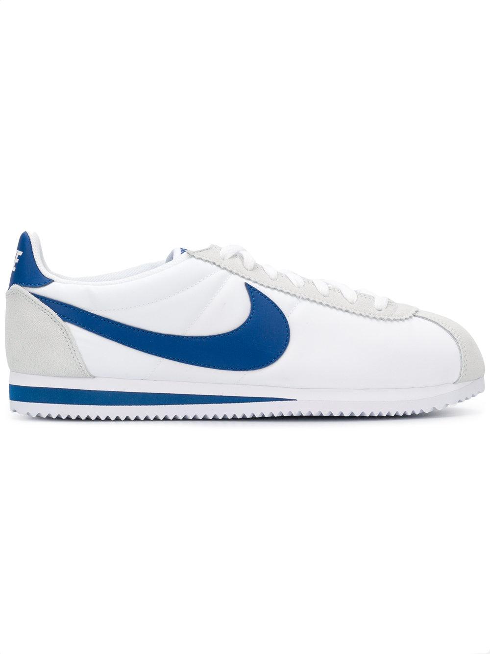 white cortez trainers