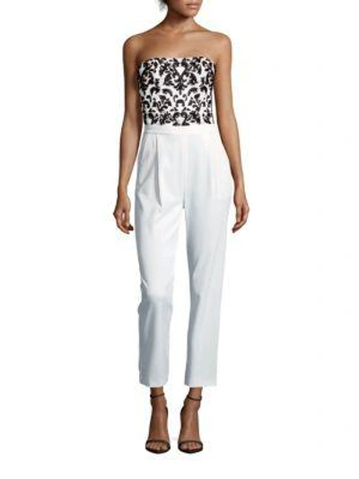Shop Alice And Olivia Jeri Beaded Strapless Jumpsuit In Off White - Black