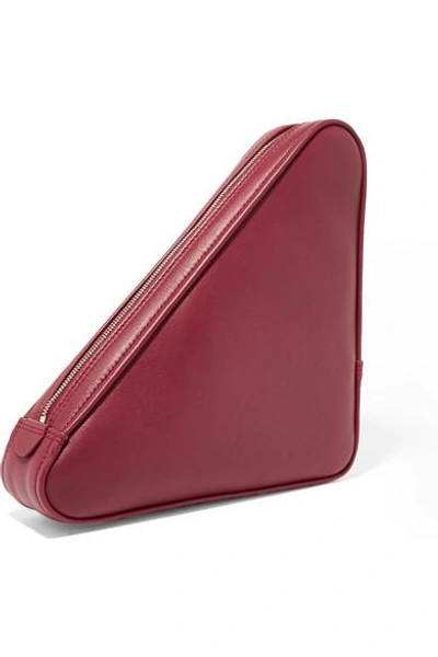 Shop Balenciaga Triangle Printed Leather Pouch In Burgundy