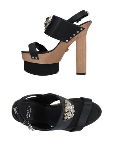 Shop Versace Sandals In Black