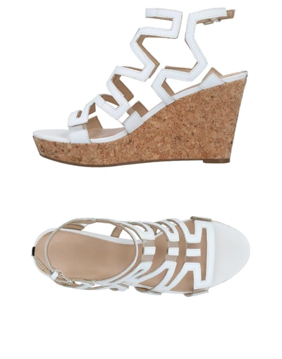 Shop Guess Sandals In White