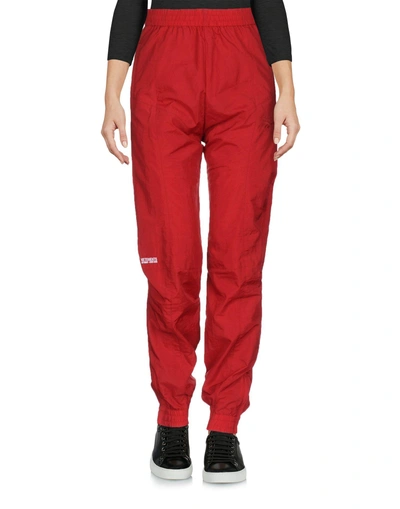 Shop Reebok Casual Pants In Red