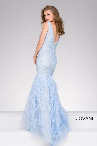Shop Jovani Feather Hem Mermaid Gown In Blue/nude