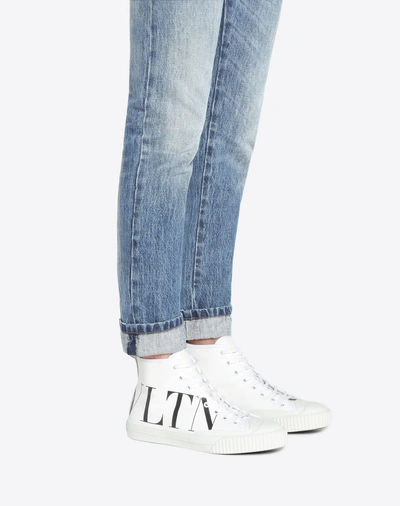 Shop Valentino Garavani Uomo High-top Canvas Sneaker With Vltn Logo In White/ Black