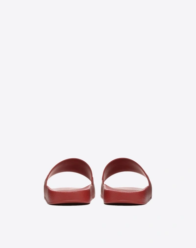 Shop Valentino Garavani Uomo Vltn Rubber Slider Sandal In Ruby