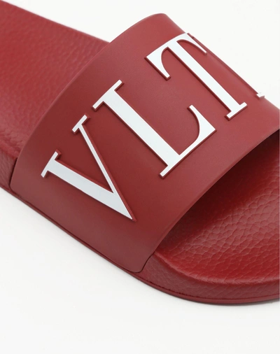 Shop Valentino Garavani Uomo Vltn Rubber Slider Sandal In Ruby