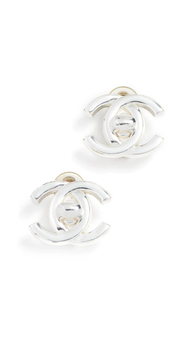 Shop Chanel Turn Lock Earrings In Silver