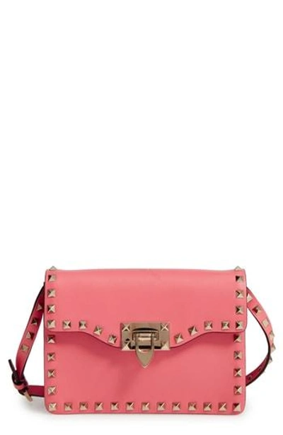 Shop Valentino Rockstud Leather Crossbody Bag - Pink In Antique Rose
