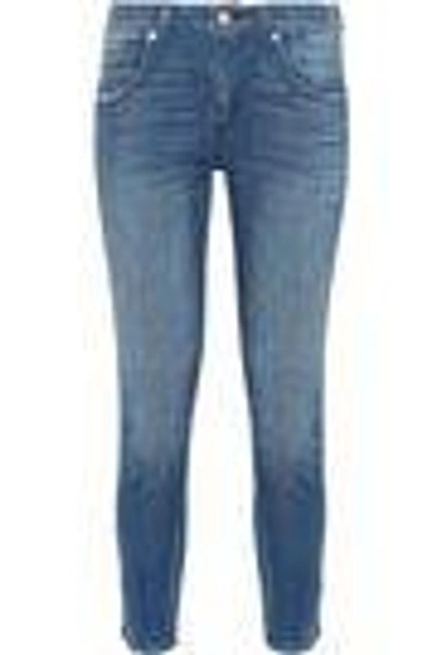 Shop Amo Twist Distressed Mid-rise Skinny Jeans In Mid Denim