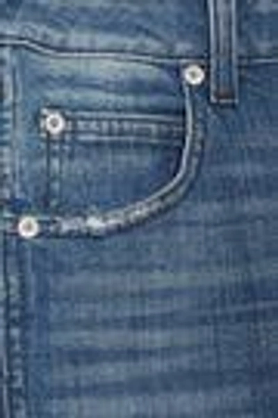 Shop Amo Twist Distressed Mid-rise Skinny Jeans In Mid Denim