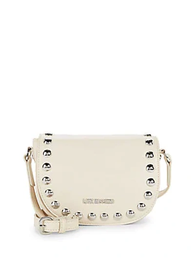 Shop Love Moschino Studded Saddle Bag In Ivory