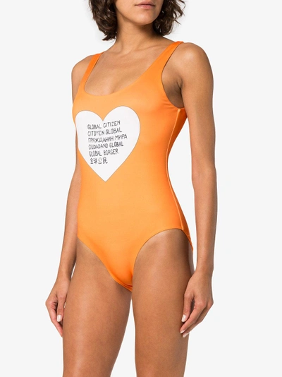 Shop Ganni Global Citizen Swimsuit In Yellow/orange