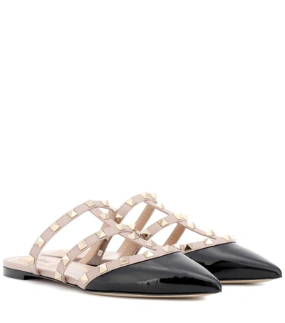 Shop Valentino Rockstud Patent Leather Slippers In Black