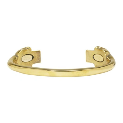 Shop Alexander Mcqueen Gold Twin Skull Bracelet