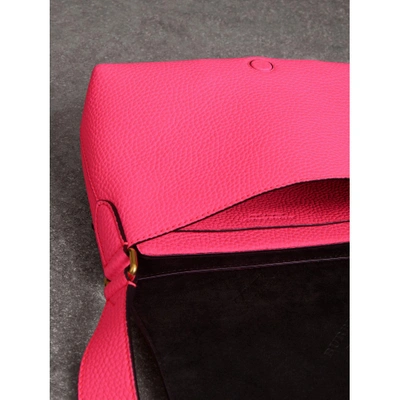 Shop Burberry Small Embossed Neon Leather Messenger Bag In Neon Pink