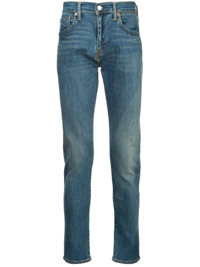 Shop Levi's Slim Tapered Jeans - Blue