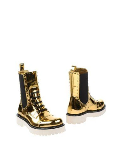 Shop Dolce & Gabbana Ankle Boots In Gold