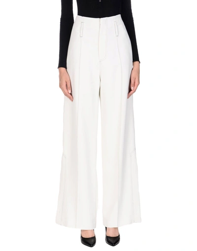 Shop Beaufille Casual Pants In Ivory
