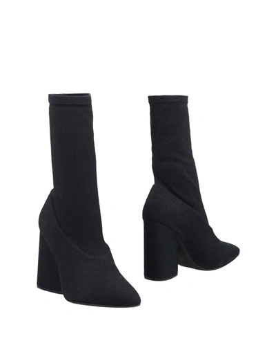 Shop Yeezy Ankle Boot In Black