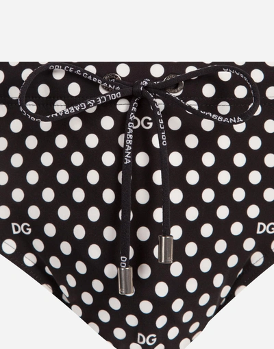 Shop Dolce & Gabbana Swimming Briefs With Dg Dots With Pouch Bag In Black