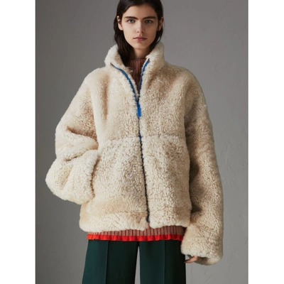 Shop Burberry Contrast Zip Shearling Funnel-neck Jacket In Natural White