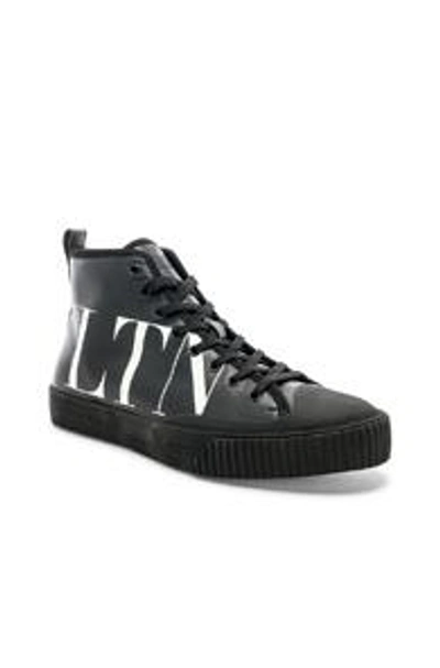 Shop Valentino Leather Vltn Hi Top Sneakers In Black