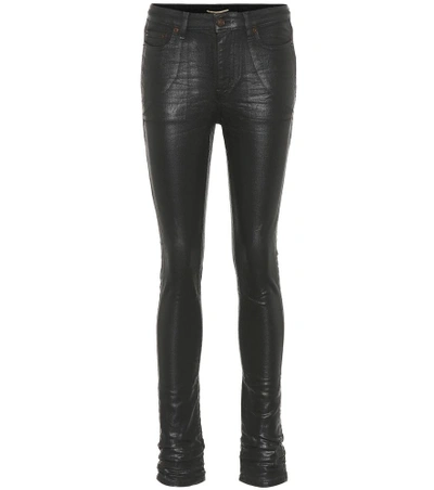 Shop Saint Laurent Coated Skinny Jeans In Black