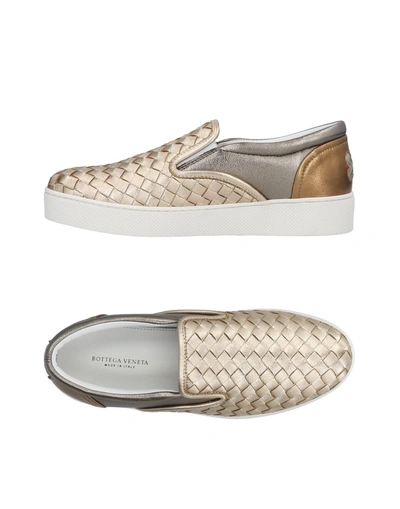 Shop Bottega Veneta Sneakers In Gold