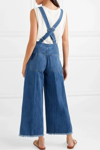 Shop Elizabeth And James Jennette Frayed Denim Overalls In Mid Denim