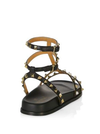 Shop Valentino Rockstud Gladiator Sandals In Black