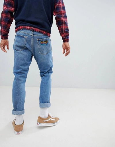 Shop Wrangler Slider Tapered Jeans With Rainbow Patch Kabel Blue - Blue