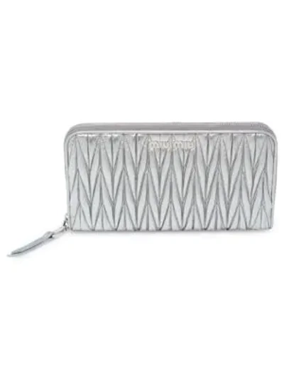 Shop Miu Miu Matelasse Leather Zip Wallet In Cromo