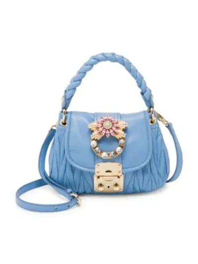 Shop Miu Miu Matelasse Leather Top Handle Bag In Astrale