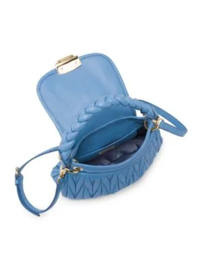 Shop Miu Miu Matelasse Leather Top Handle Bag In Astrale