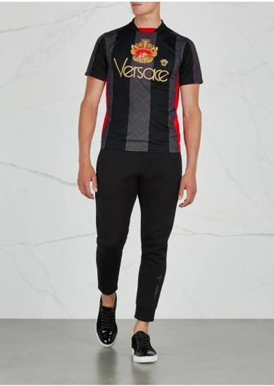 Shop Versace Printed Jersey T-shirt In Black