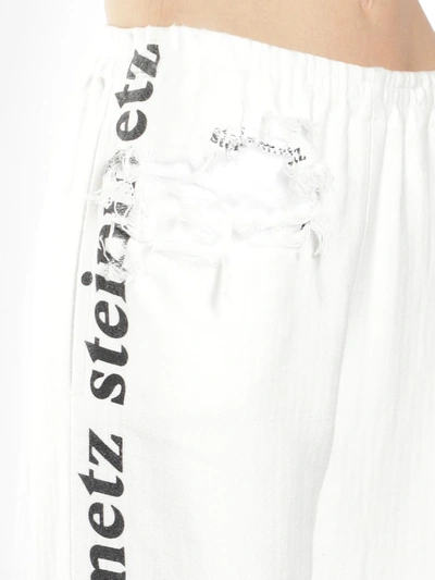 Shop Faustine Steinmetz Women's Off White Destroyed Logo Sweatpants In Runway Piece